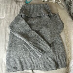 And Taylor cow neck sweater with bell sleeves. Color gray. Size large.